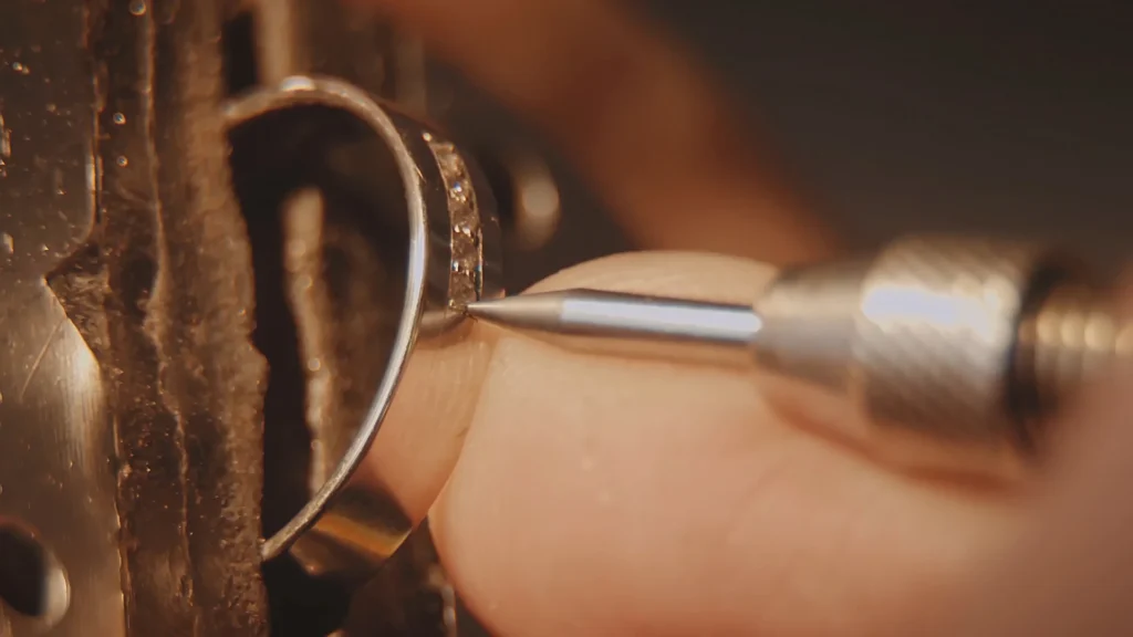 Jeweler meticulously working on a diamond ring setting in Orlando