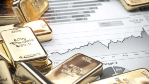 Gold bars resting on a financial chart with an upward trend, symbolizing gold investment and market growth